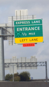 Self Help Radio logo on a highway sign that is trying to convey too much information
