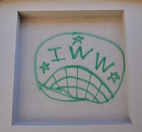 IWW logo made by green graffitti