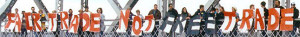 people holding letter signs: Fair Trade not free trade