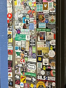 A close-up of one of the well-stickered cabinets at KBOO.