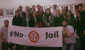 people with a banner saying No Trimet Jail