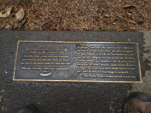 A bronze plaque with two columns of text: The leftmost says John Reed October 22, 1887 to October 17,1920 John Silas Reed, world renowned journalist and author of Ten Days That Shook The world was born at the family home very near this spot. 