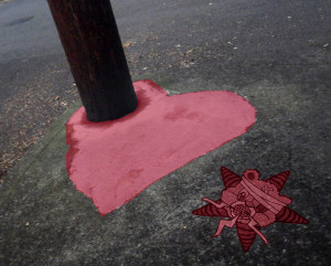 A painted heart on the pavement with the Self Help Radio logo next to it