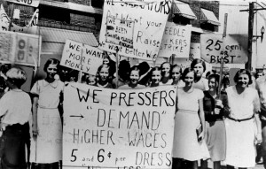 Women protesting for better wages in a black and white photograph