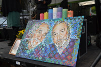 Pot Illuminati candles alongside portrait of Eddy Lepp and Jack Herer