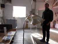 Sean Healy and his sculpture "Slow Roll." Sean Healy and his sculpture "Slow Roll."